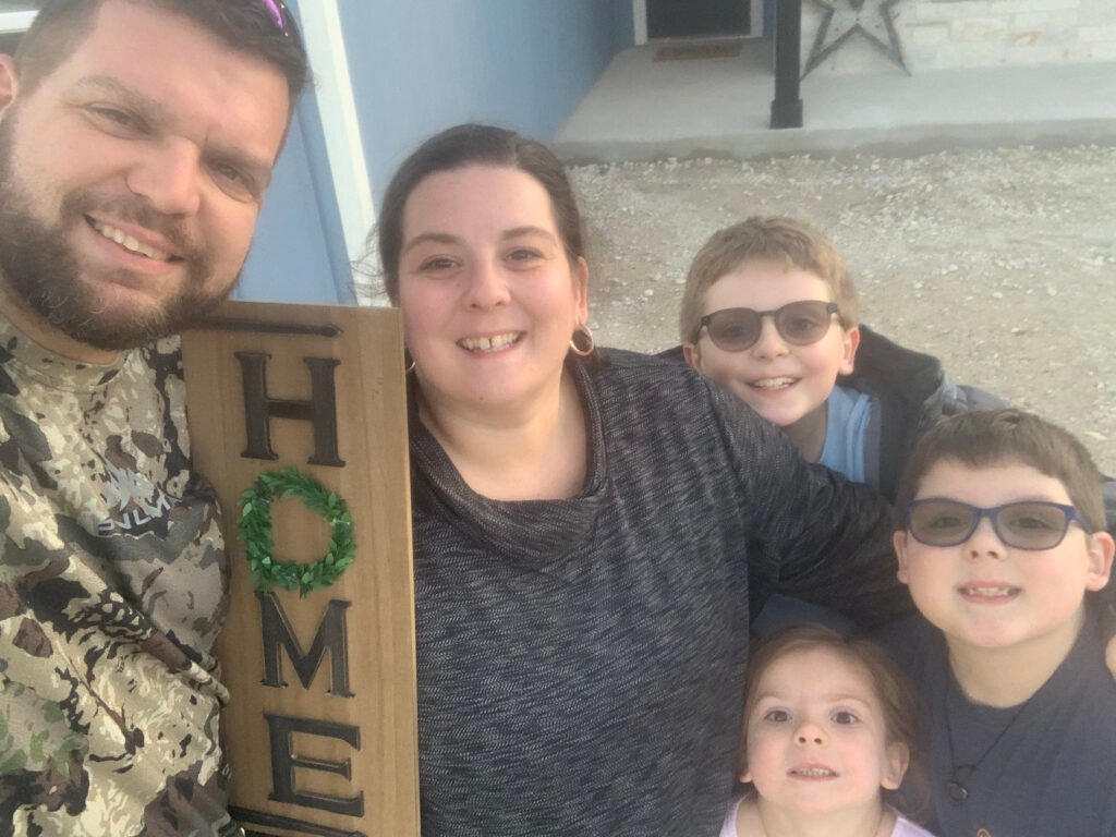 Family with home sign-homemaking